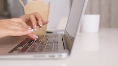 Close-Up View of Person Using Her Laptop