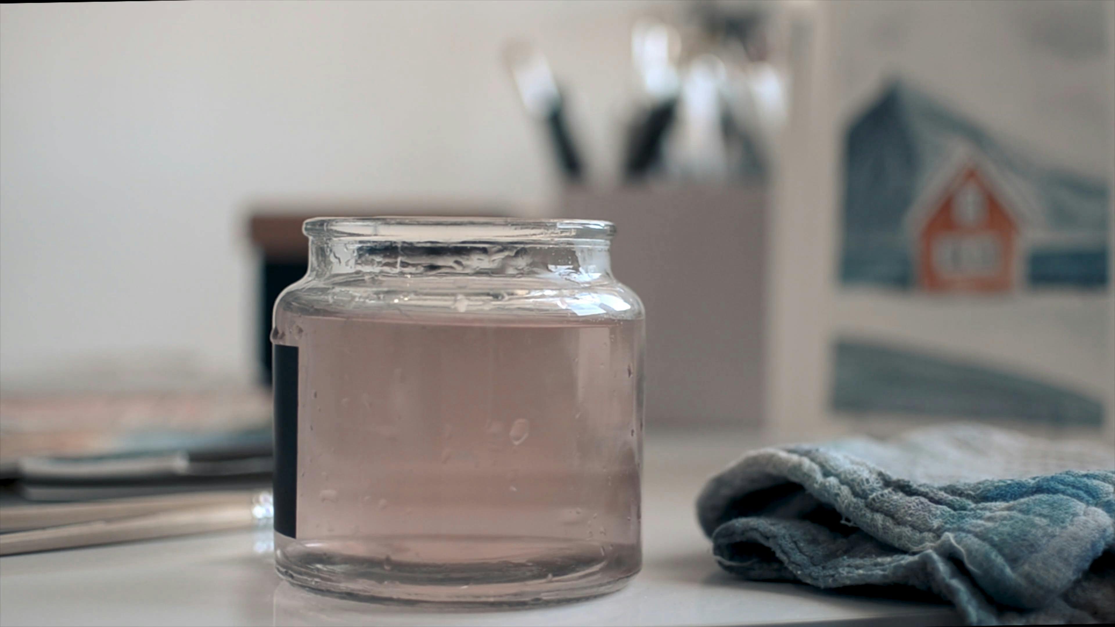 A Person Dipping a Paint Brush into the Water · Free Stock Video