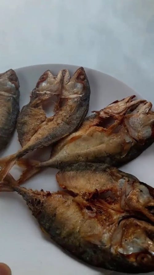 Fried Fishes Served On A Ceramic Plate