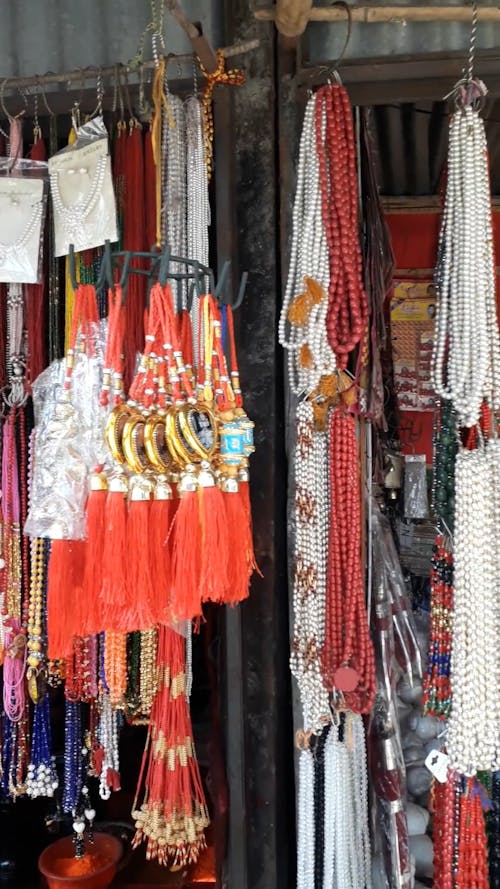 Stores Along The Street With Different Merchandises On Display