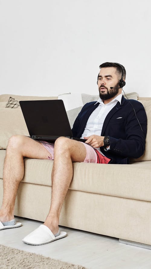 A Man Working From Home Engage In A Video Conference