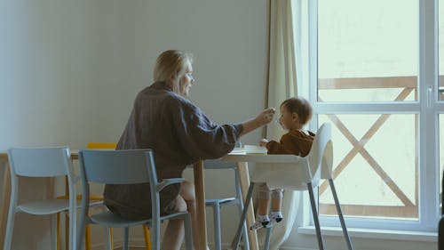 Mother Feeding her Son