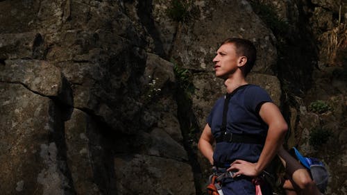 A Man Getting His Hiking Gear Strapped