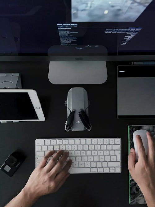 A Man Working On Modern Computers