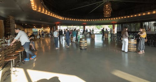 A Crowd Of People Attending An Event In A Pavilion