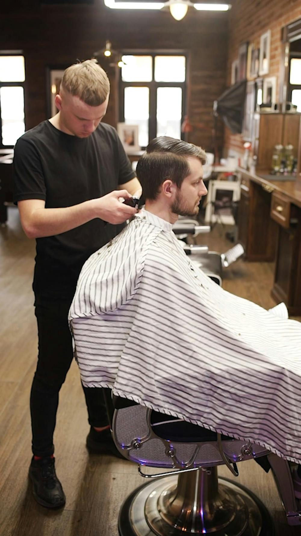 A Barber Trimming the Beard of a Client · Free Stock Video