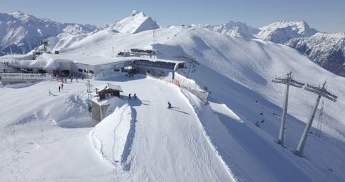 Drone Footage of People Skiing in Ski Resort