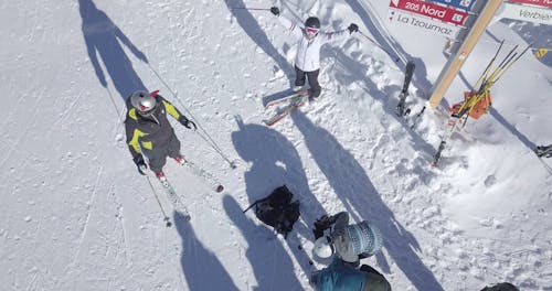 Drone Footage of People Skiing in Ski Resort