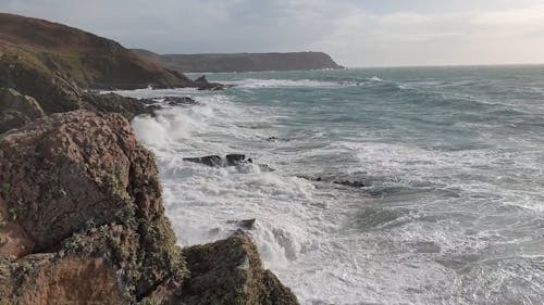 Ocean Waves Crashing with the Rocky Shore