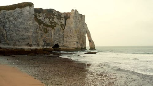 A Sea Stack By The Coast Line Cause By Erosion