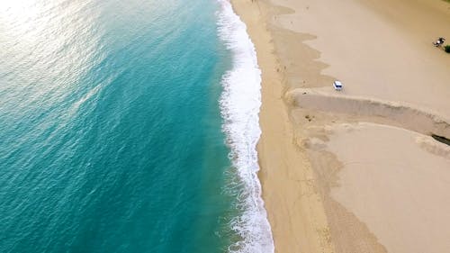 Aerial Footage of Waves Crashing on Shore