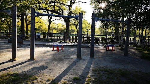 Swings For Kids In A Park Playground