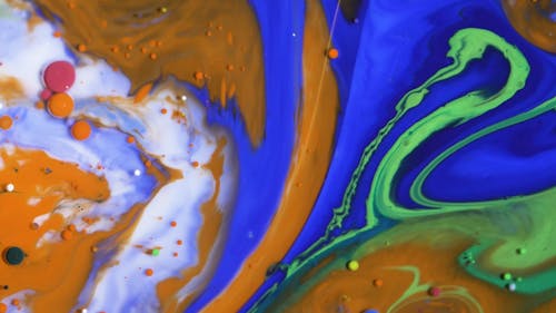 Mixing Liquid Paints To Form Abstract Art