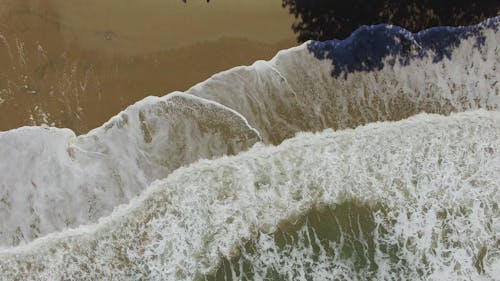 Drone Shot of Crashing Waves on the Beach