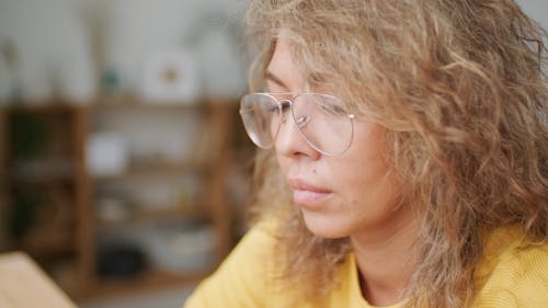 A Woman Typing on a Laptop