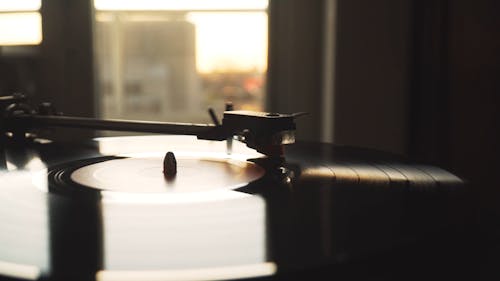 A Close-Up Shot- of a Vinyl Record Rotating on a Turntable