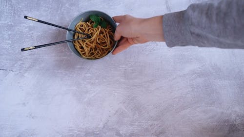 Two Servings Of Noodle Dish In A Bowl