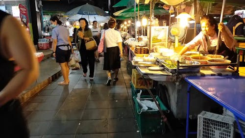 People In The Market At Nightime