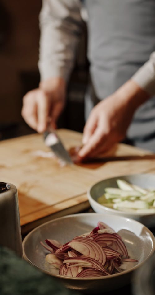 A Man Cutting An  Onion