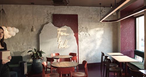 A Woman Receptionist Inside A Restaurant