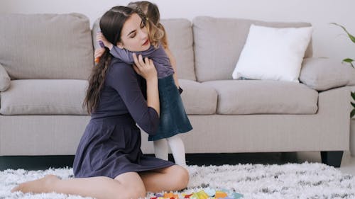 Girl Hugging Her Mother