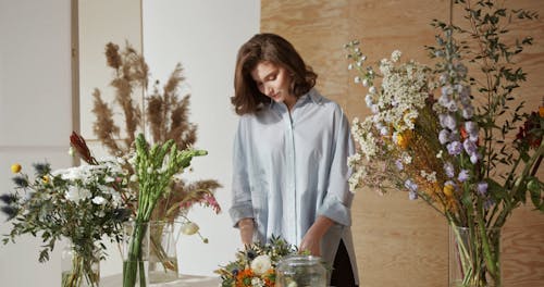 Woman Arranging Flowers