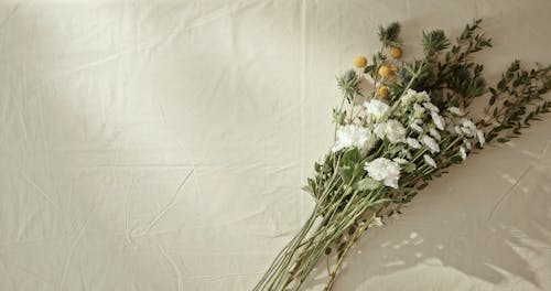 A Person Preparing Flowers For A Vase