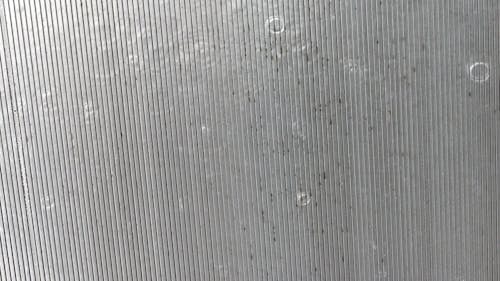 Rain Pouring on an Aluminum Slots