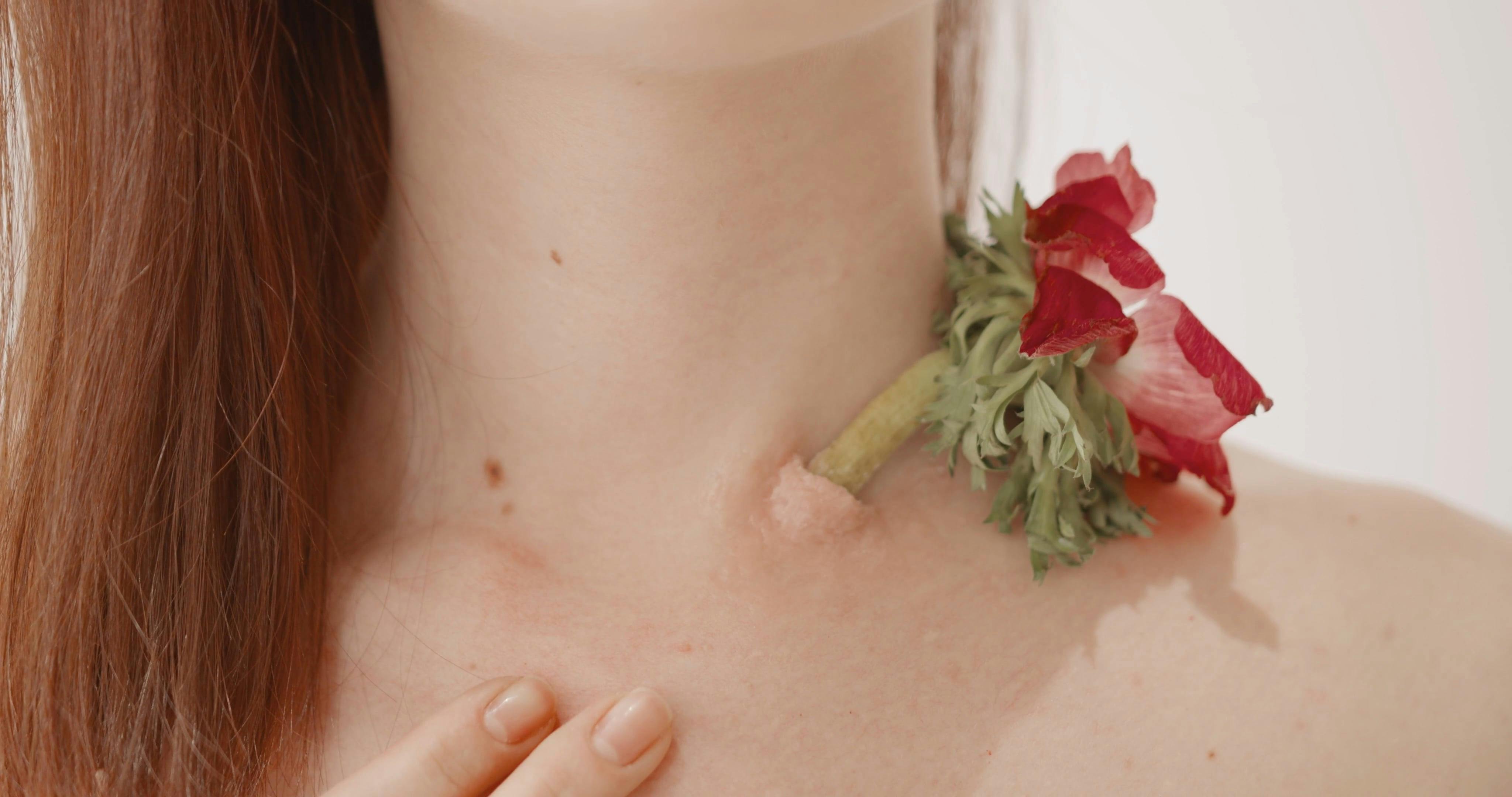 A Woman With A Flower On Her Neck · Free Stock Video
