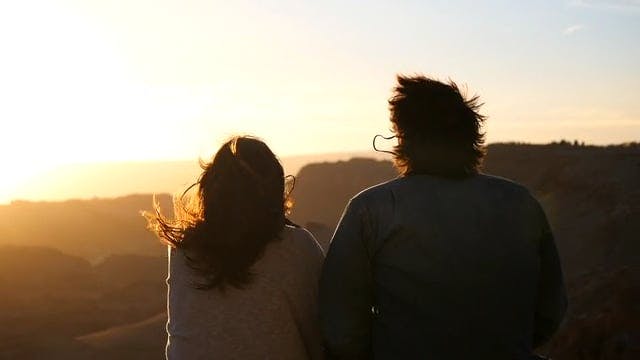 Man And Woman Watching The Sun Set · Free Stock Video