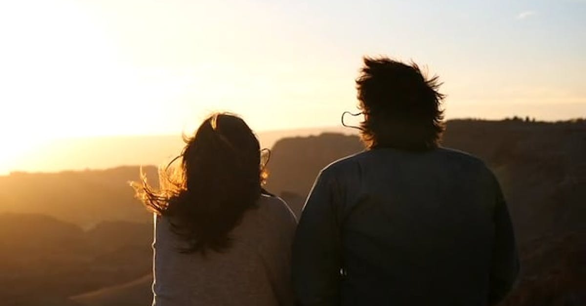 Man And Woman Watching The Sun Set · Free Stock Video