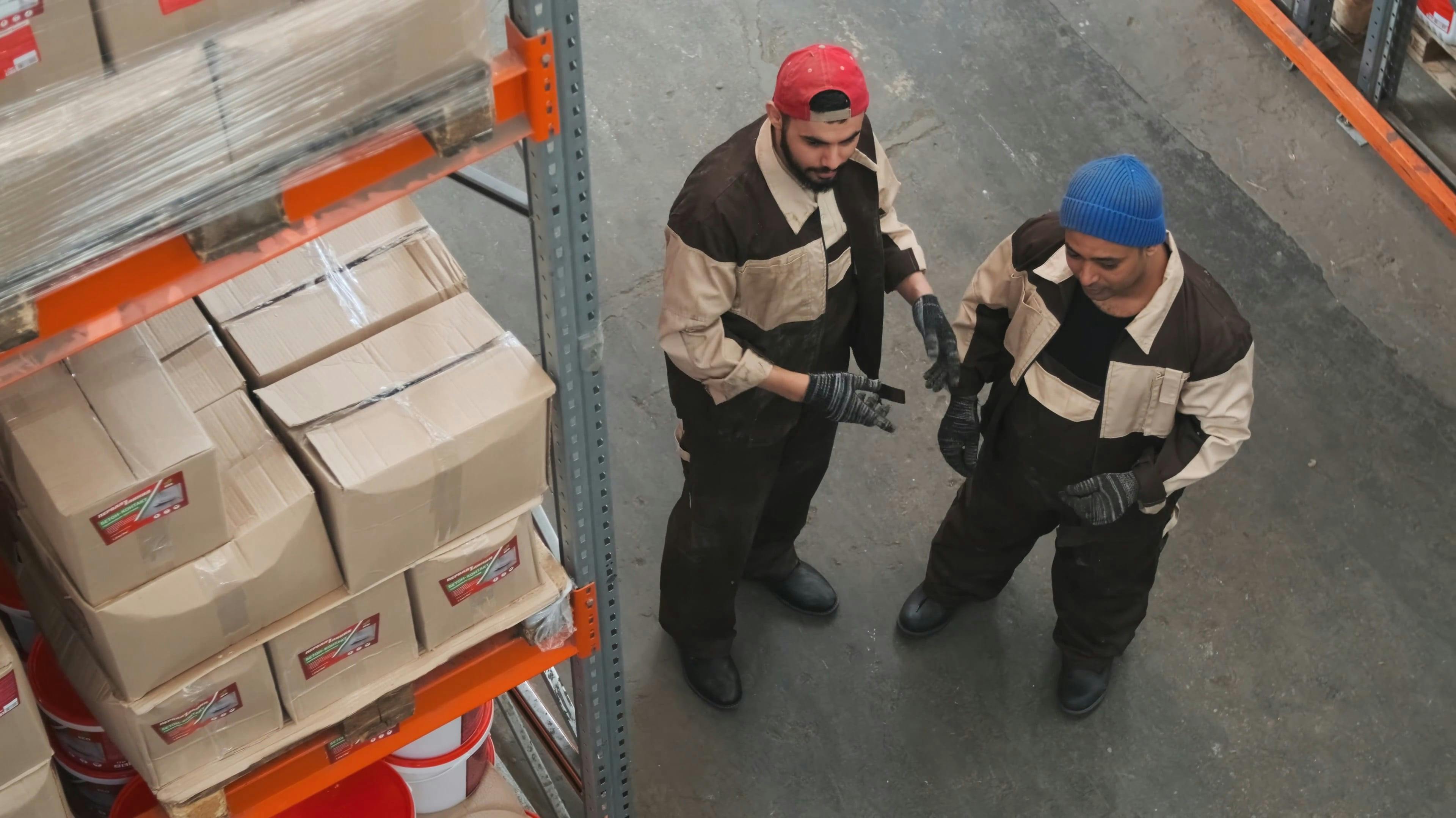 Three Men Working In A Hardware Store Warehouse · Free Stock Video