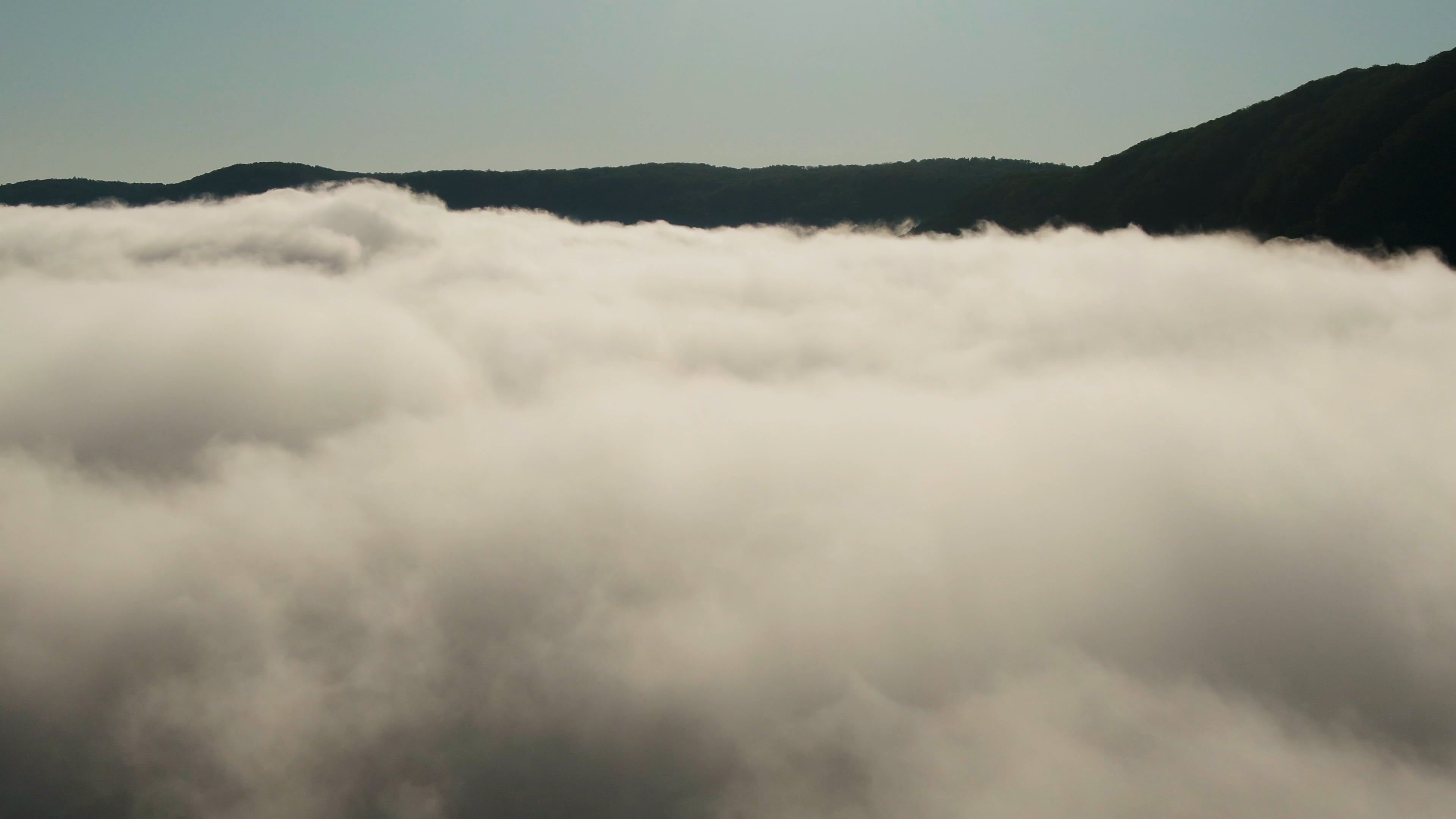 Drone Shot Of Low Lying Clouds Over The Mountain Valley Free Stock ...
