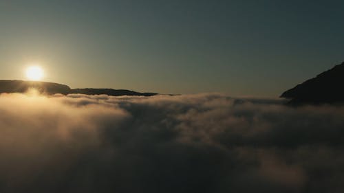 Drone Footage Of Low Lying Clouds In The Mountain Valley
