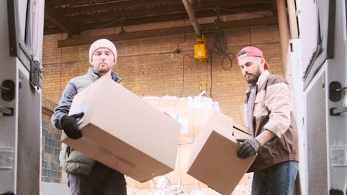 Men Loading Boxes into the Van