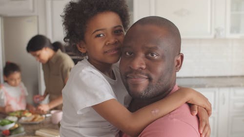 A Family Staying At Home Spending Time Together