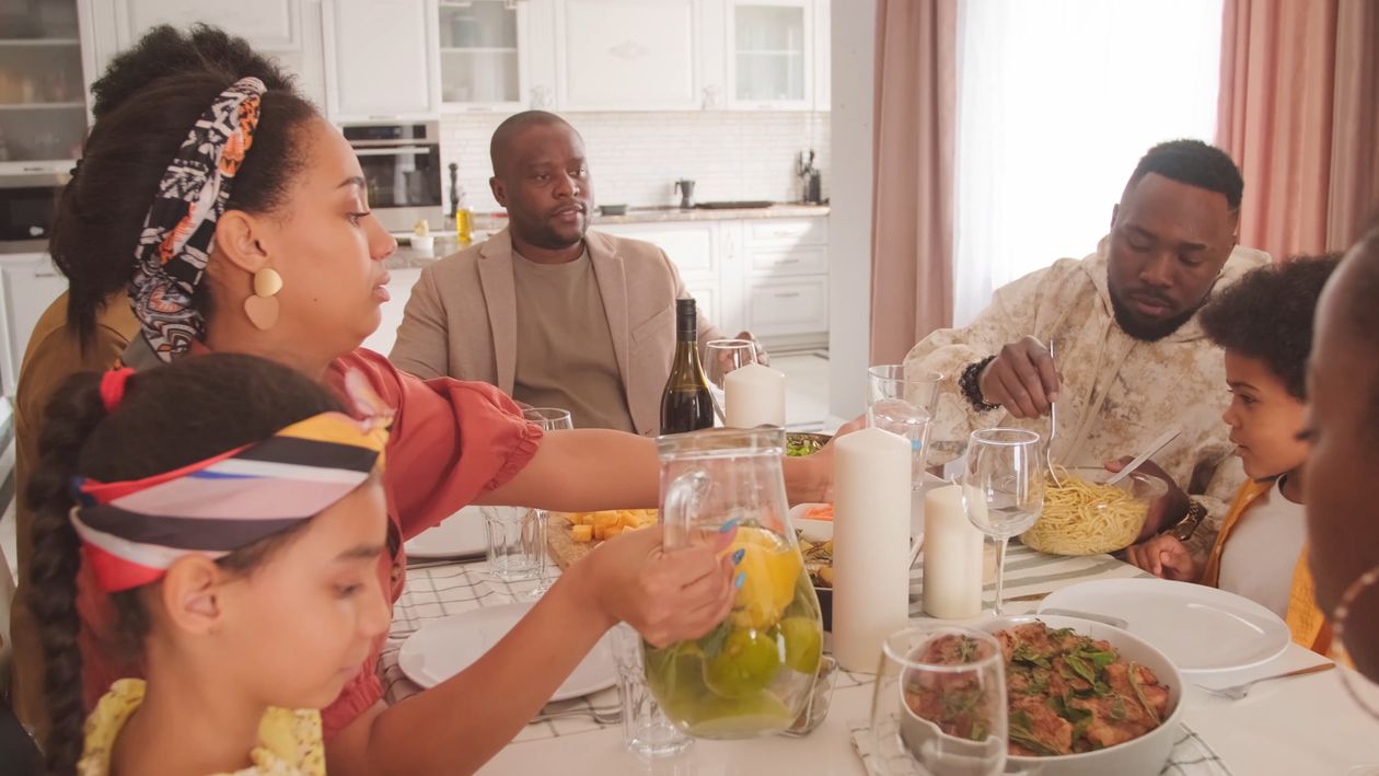 A family enjoying conversation together at the dinner table