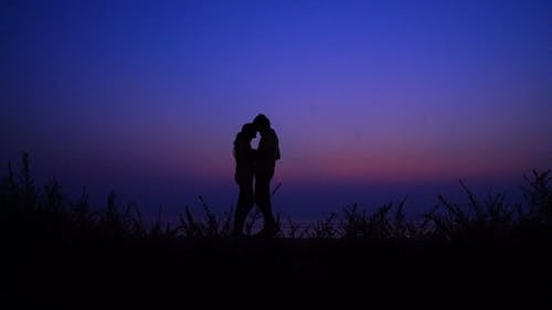An Artistic Shot Of A Couple In Romantic Position 