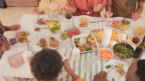 A Family Celebrating A Holiday By Dining Together