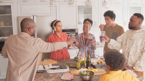 Family Gathers at the Kitchen while Drinking Wine