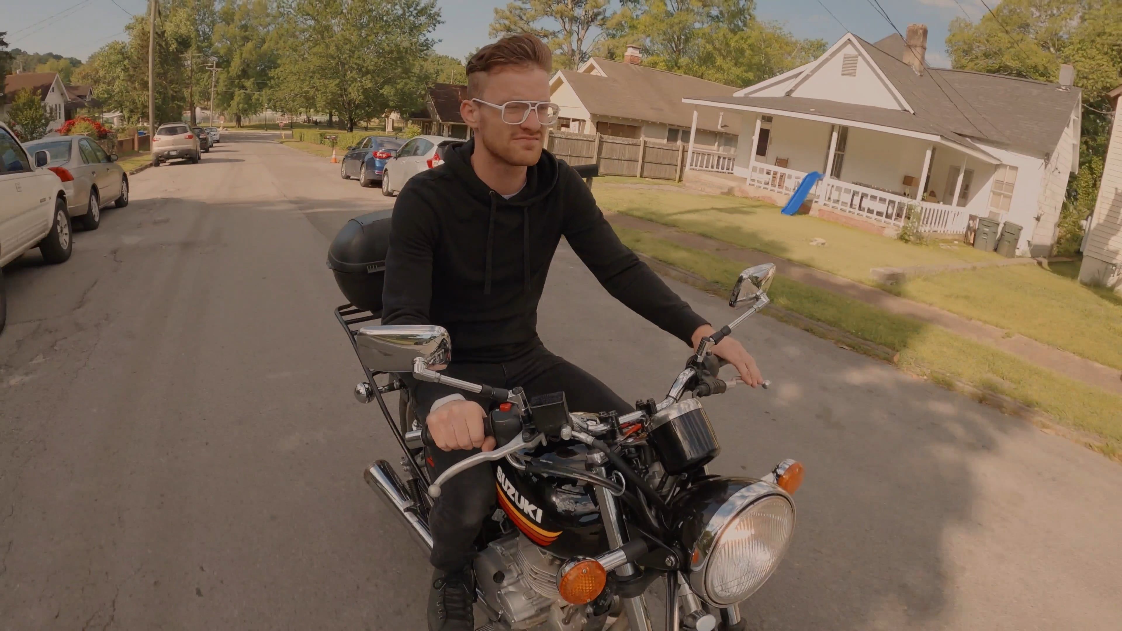 A Man Riding A Motorcycle In The Neighborhood Free Stock Video Footage ...