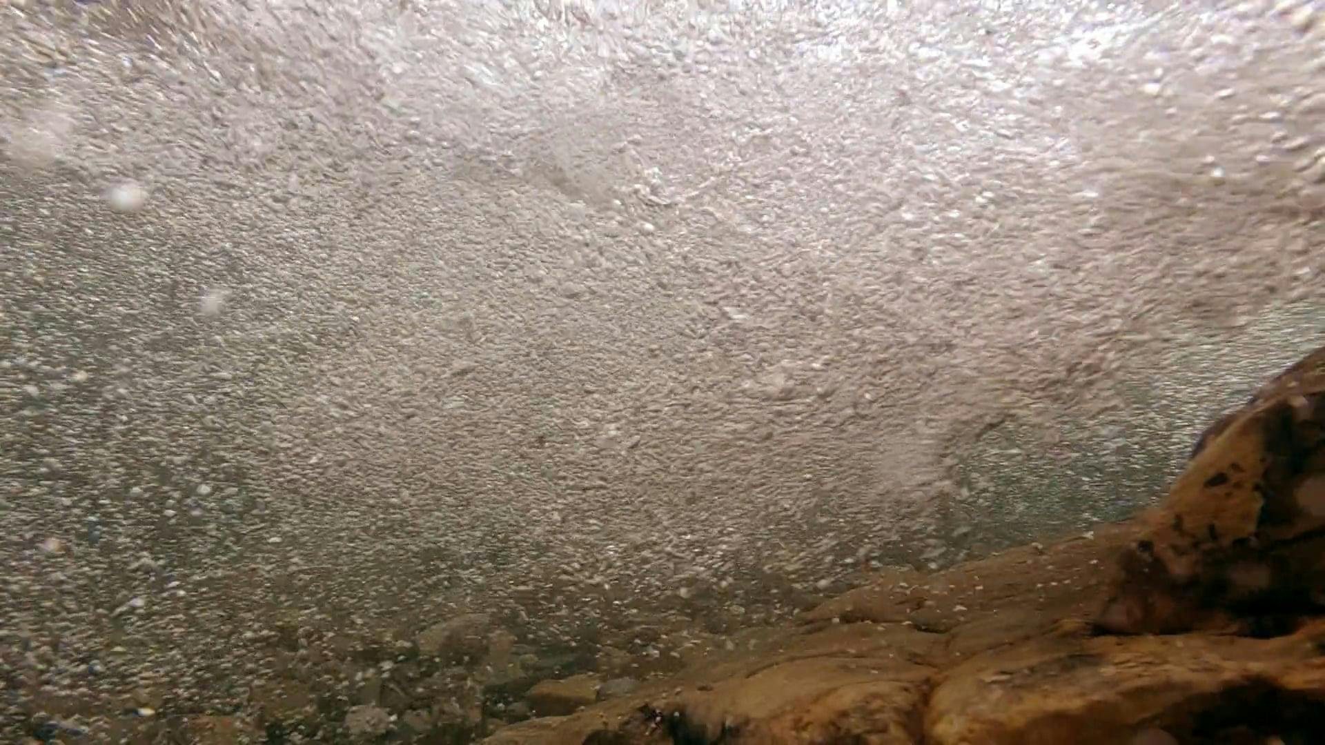 Under Water Footage of River Water Forming Bubbles · Free Stock Video