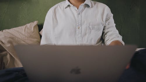 A Man Closing the Laptop Cover