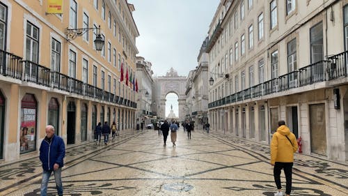 People Walking in the Town Square 