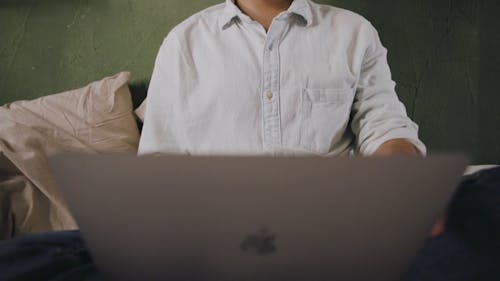 A Man Closing His Laptop