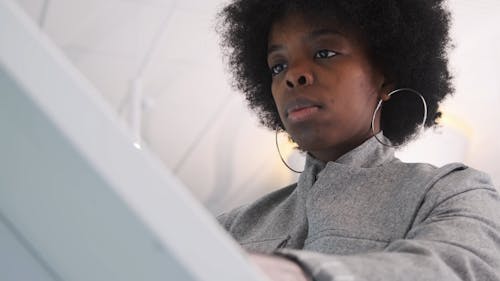 Woman Using the Touchscreen Computer