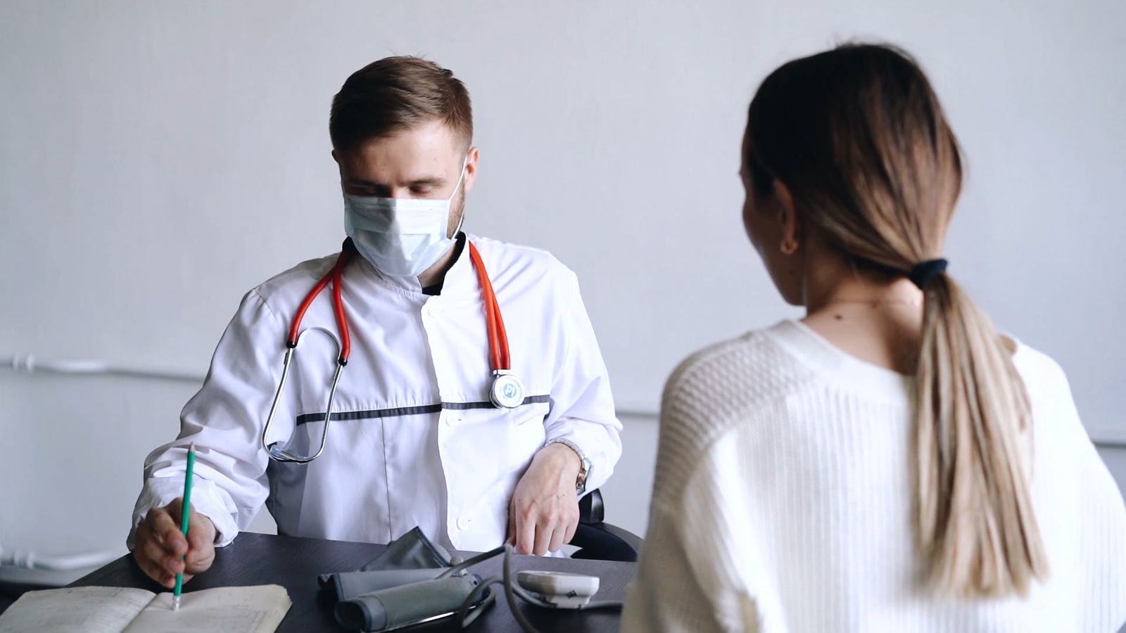 A doctor consulting with a patient