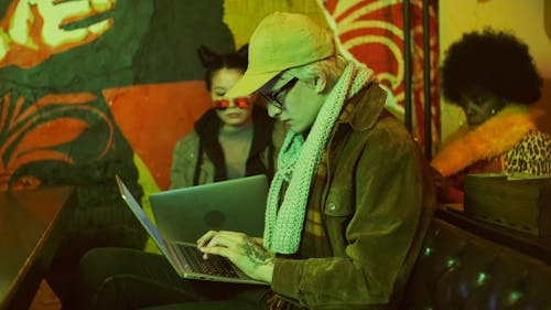 Man and Women Using Laptop
