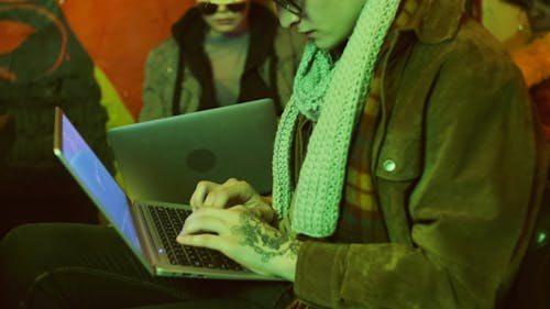 Man Typing on the Laptop