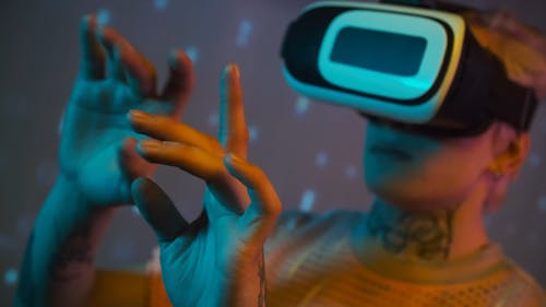 A Young Man Acting Up On Images Of A Virtual Reality Gear